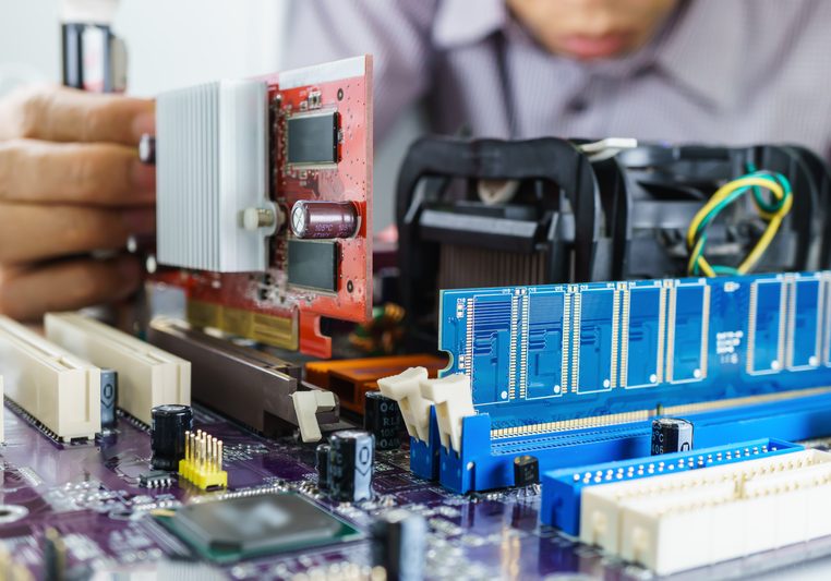 Technician's hands Installing VGA card